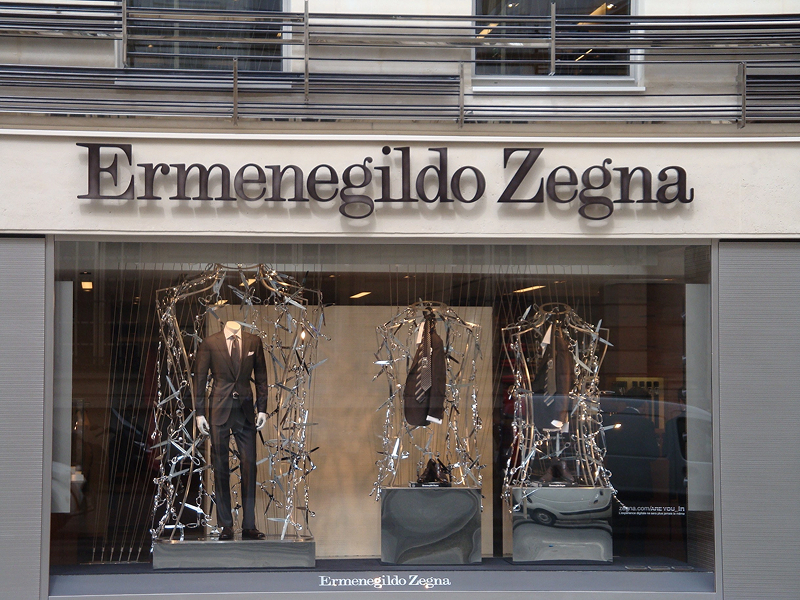 Window displays suits and accessories at Ermenegildo Zegna store.